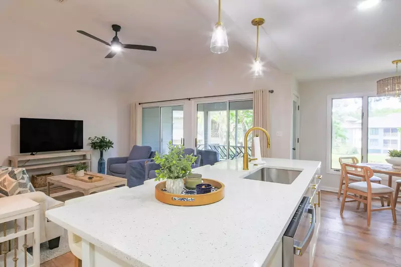 The kitchen, dining area and living room receive wonderful natural light.