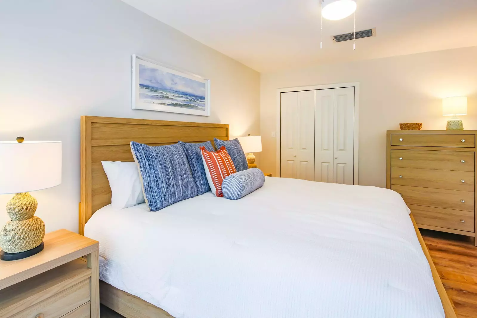 The bedroom also features a closet and dresser.