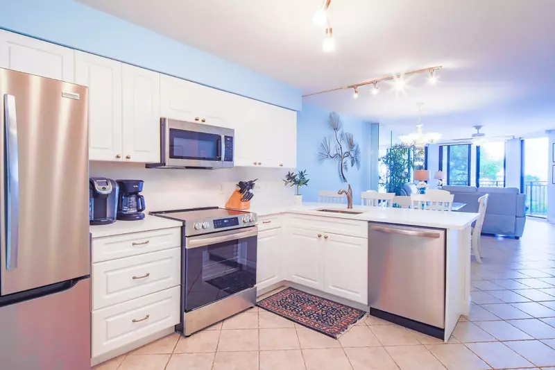 The renovated kitchen features all new stainless steel appliances.