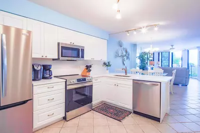 The renovated kitchen features all new stainless steel appliances.