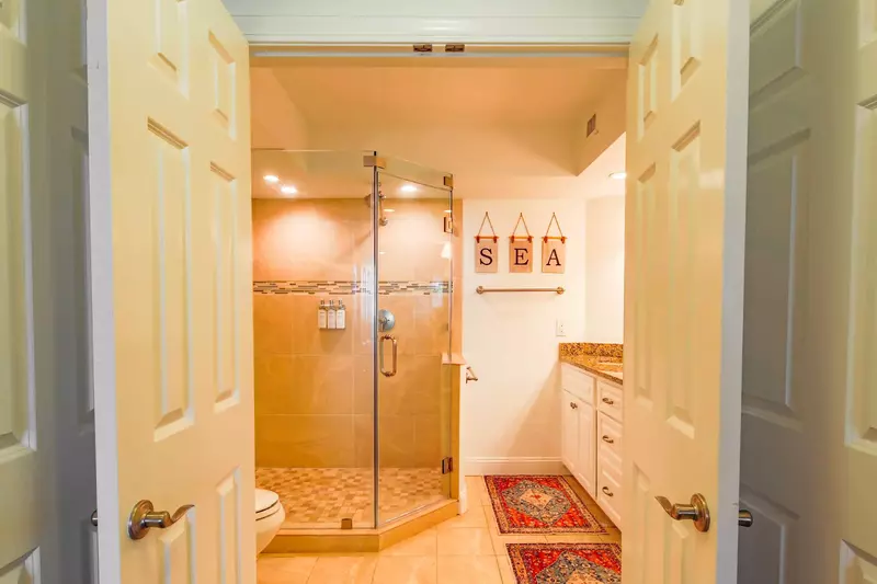 The master bedroom features a spacious en suite bathroom.