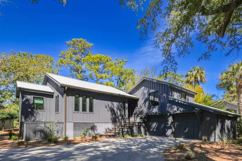 Marsh Island Retreat is a surrounded by palmettos, pines and other trees within Kiawah's maritime forest.