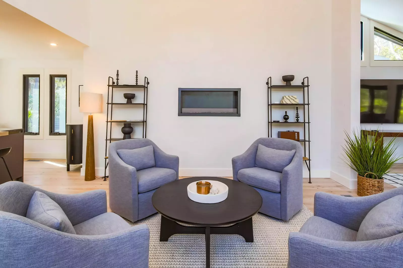 This seating area is located in between the kitchen, dining area and living room.