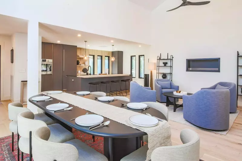 The dining table seats 8.  There are 4 additional stools at the kitchen island.