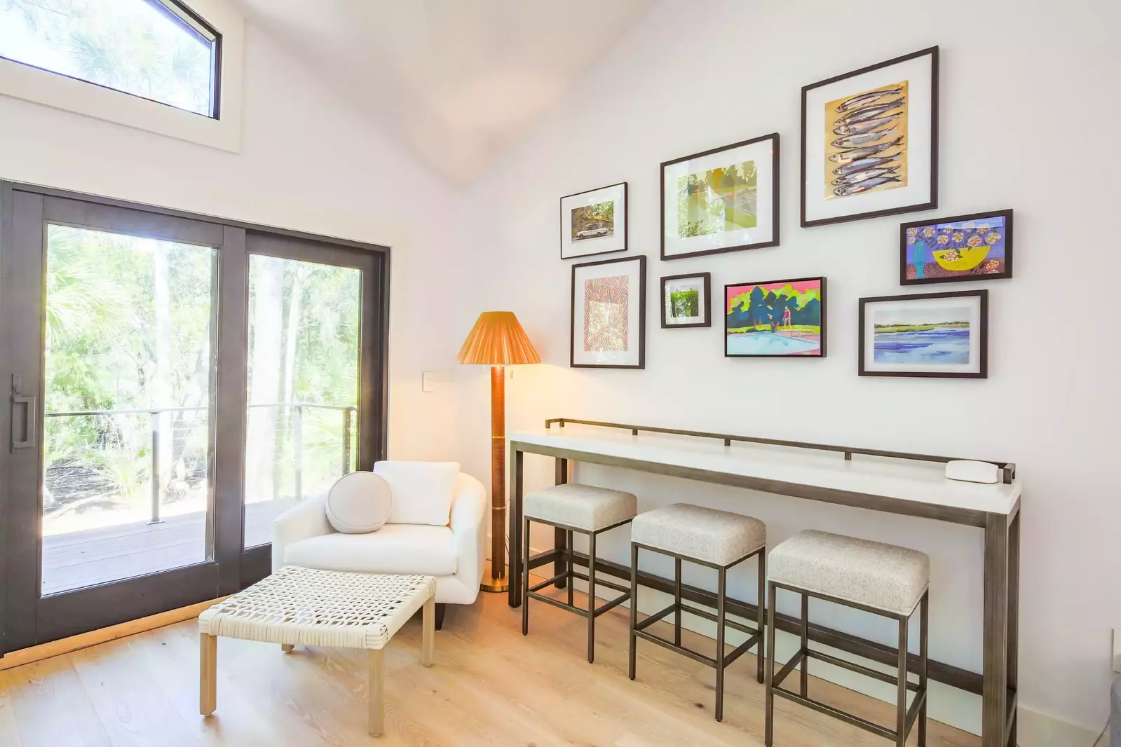 This sitting area and table are located in the living room near the door to the back deck.
