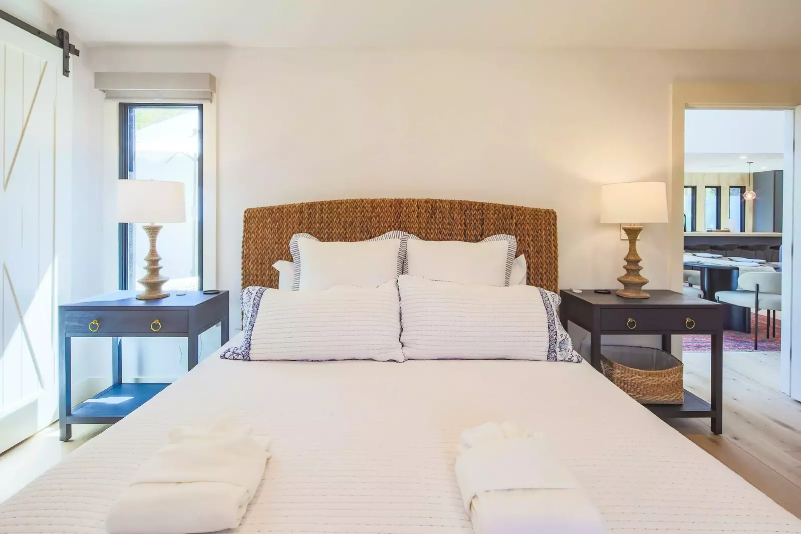 The primary bedroom is located off of the dining area.