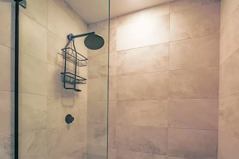 The en suite bathroom also has a tiled, walk-in shower.