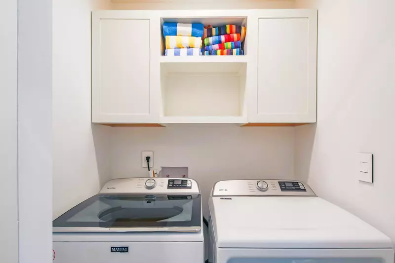 There is a full-sized washing machine and dryer in the home.