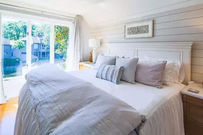 The master suite features a king bed, terrific natural light and views of the lagoon.