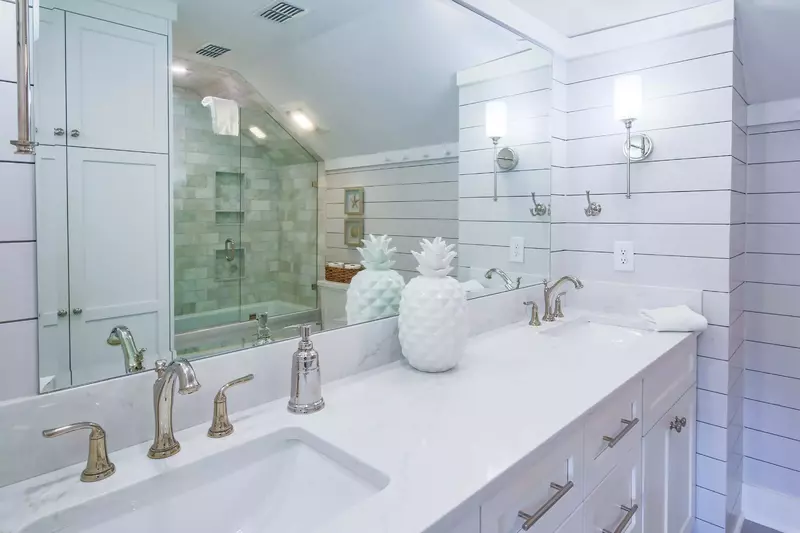 The master suite features a dual sink vanity with marble counters.