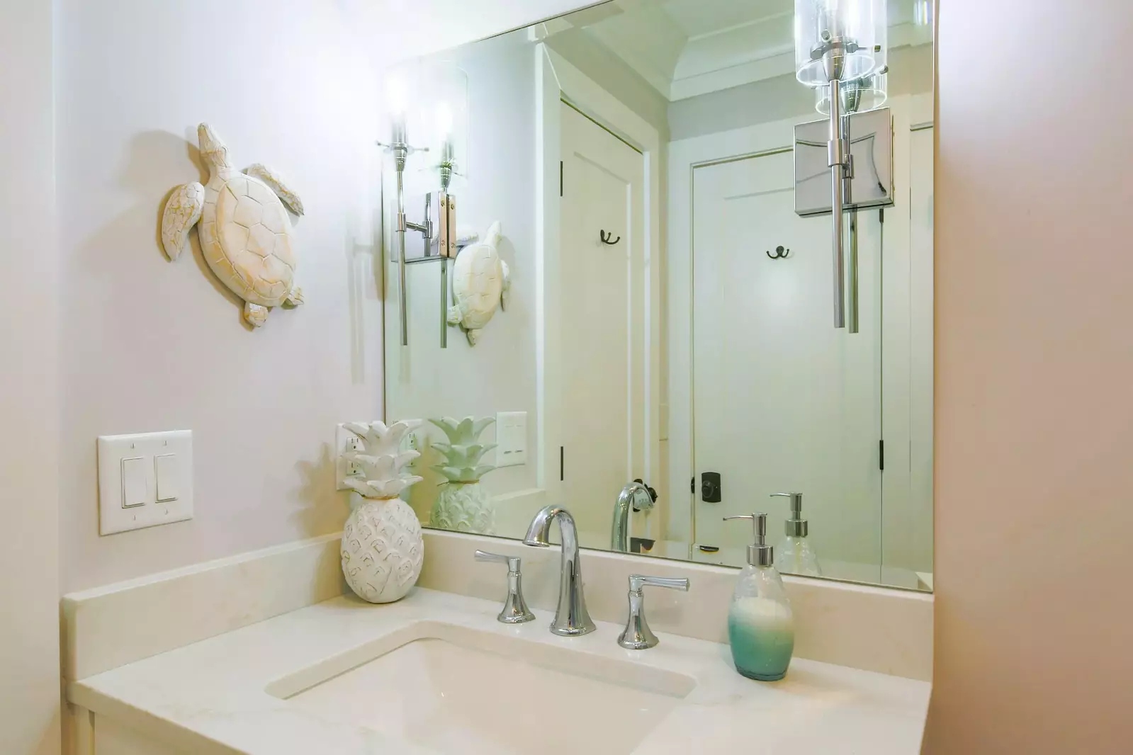 The guest bathroom features a spacious vanity.