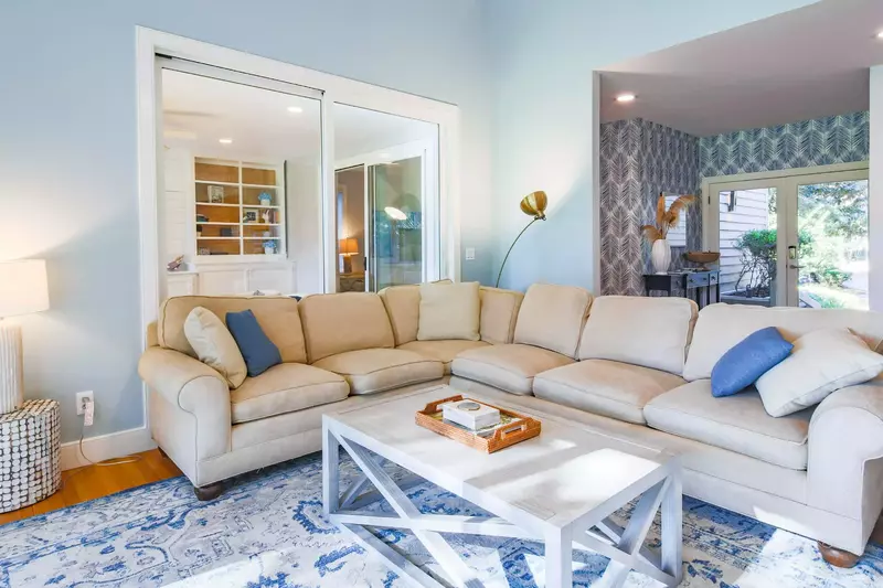 The entryway flows into the spacious living room.