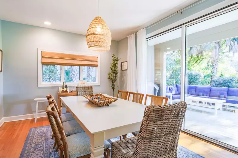 Open the sliding glass door to access the back deck with an outdoor sectional sofa.