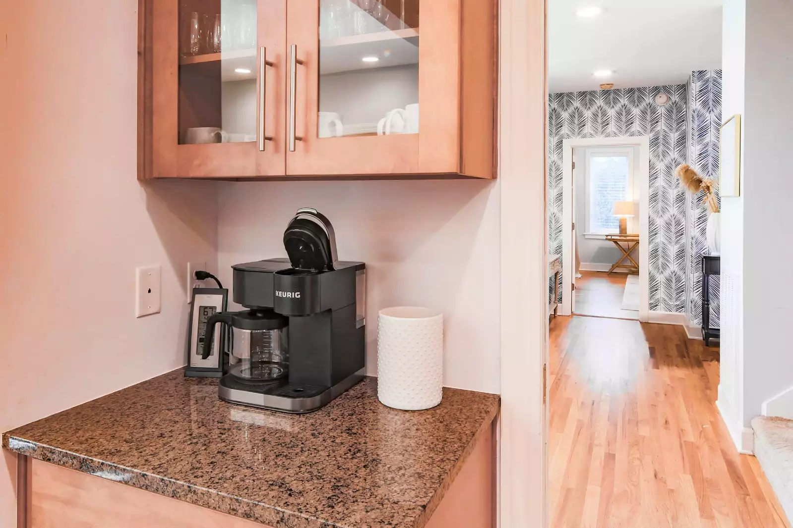 The kitchen leads to the entryway, master suite and the stairwell to the upper levels.