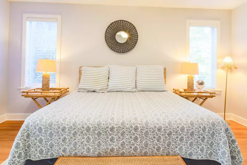 The master suite also has two night stands with reading lamps.