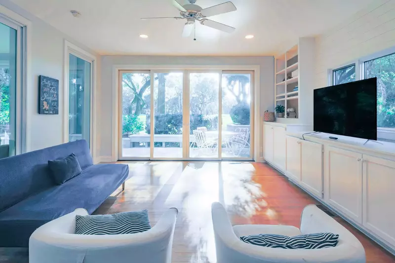 This seating area with wonderful natural light connects to both the master suite.