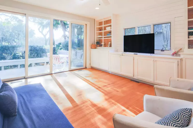This room also features built-in cabintry, a smart TV and sliding door access to the back deck.