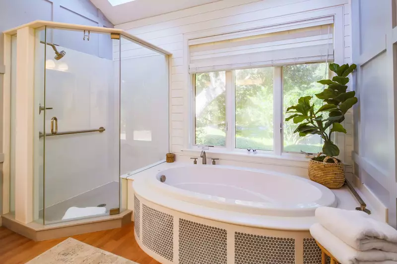The master bathroom also features a walk-in shower and soaking tub.