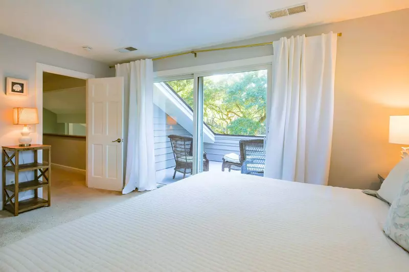 The king suite also features a private balcony with outdoor seating area.