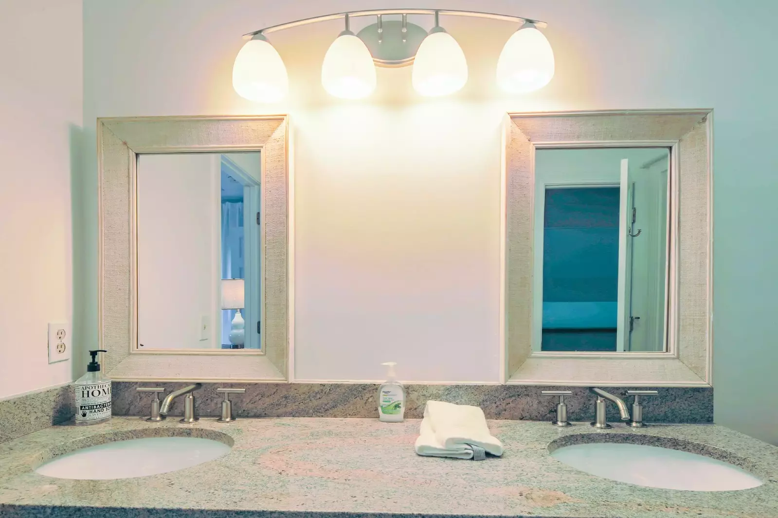 The en suite bathroom features a dual sink vanity.
