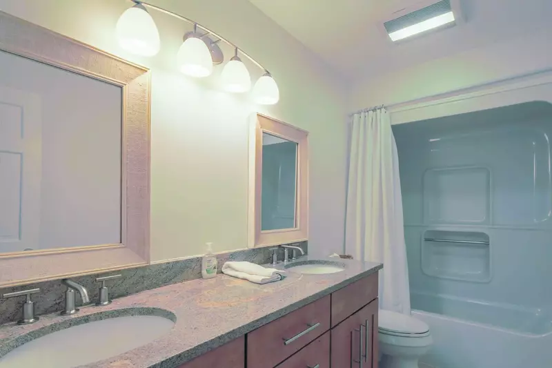 The en suite bathroom also has a shower/tub combo.