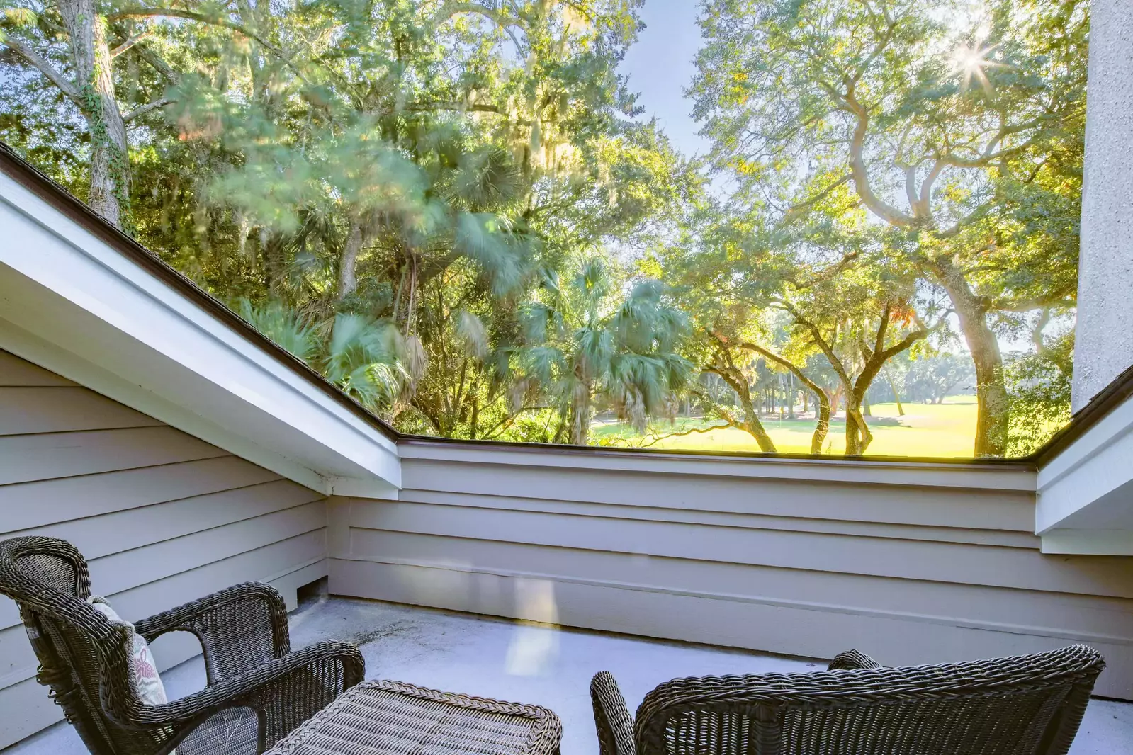 This private deck also overlooks the golf course and the treetops.