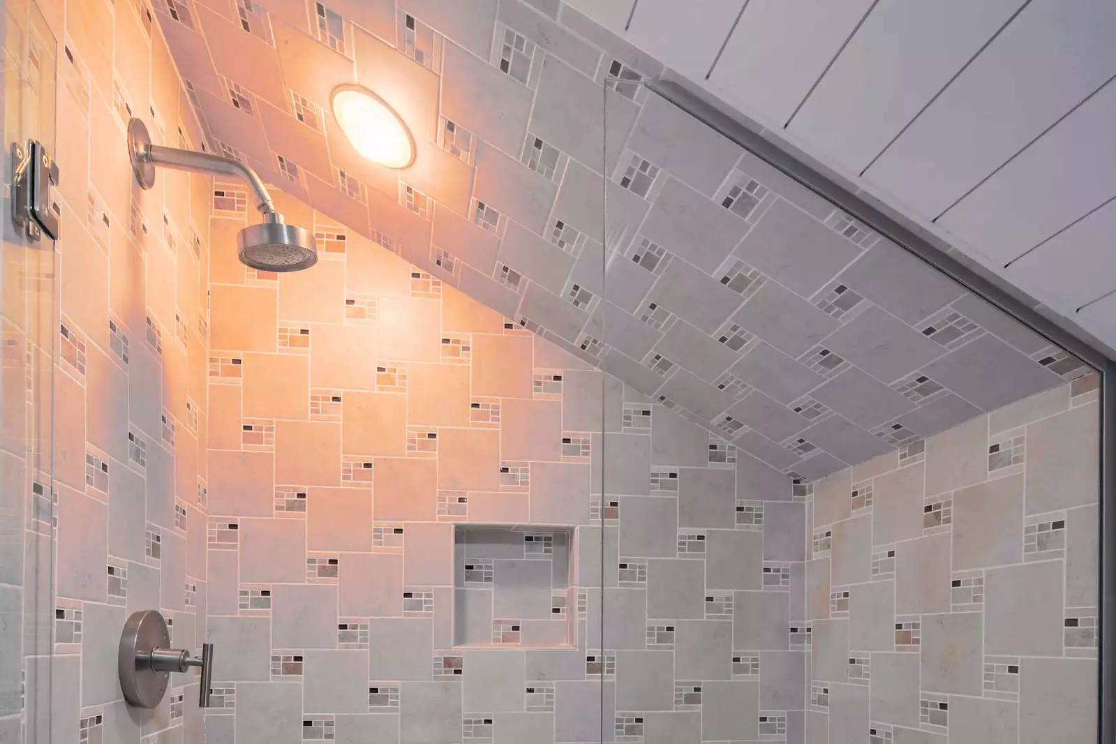 The en suite bathroom also has a tiled, walk-in shower.