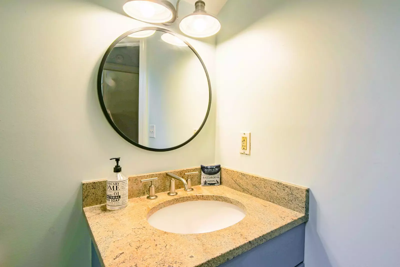 The en suite bathroom features a spacious vanity.