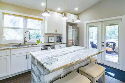 Waterway Oasis also features a gorgeous kitchen with a central island and stainless steel appliances.