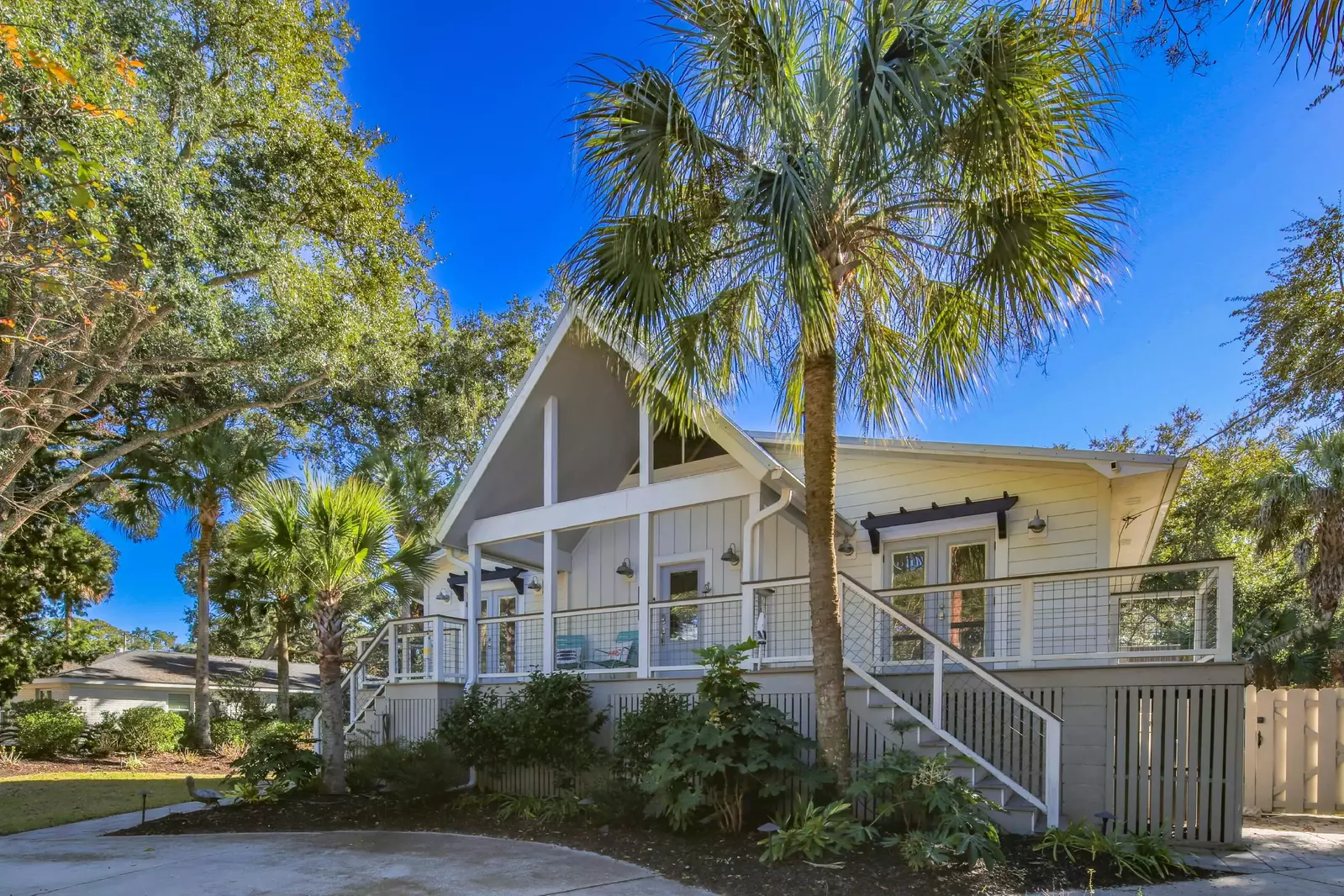 The front door entrance to this oasis is located up the stairs from the driveway.