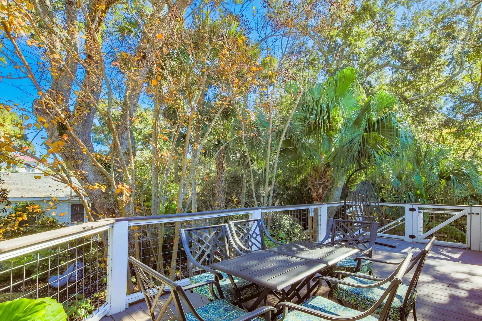 The gate on the side deck leads to a staircase down to the backyard.