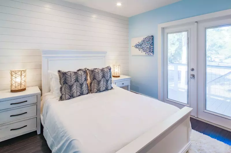 The queen bedroom also features a door to the front porch.