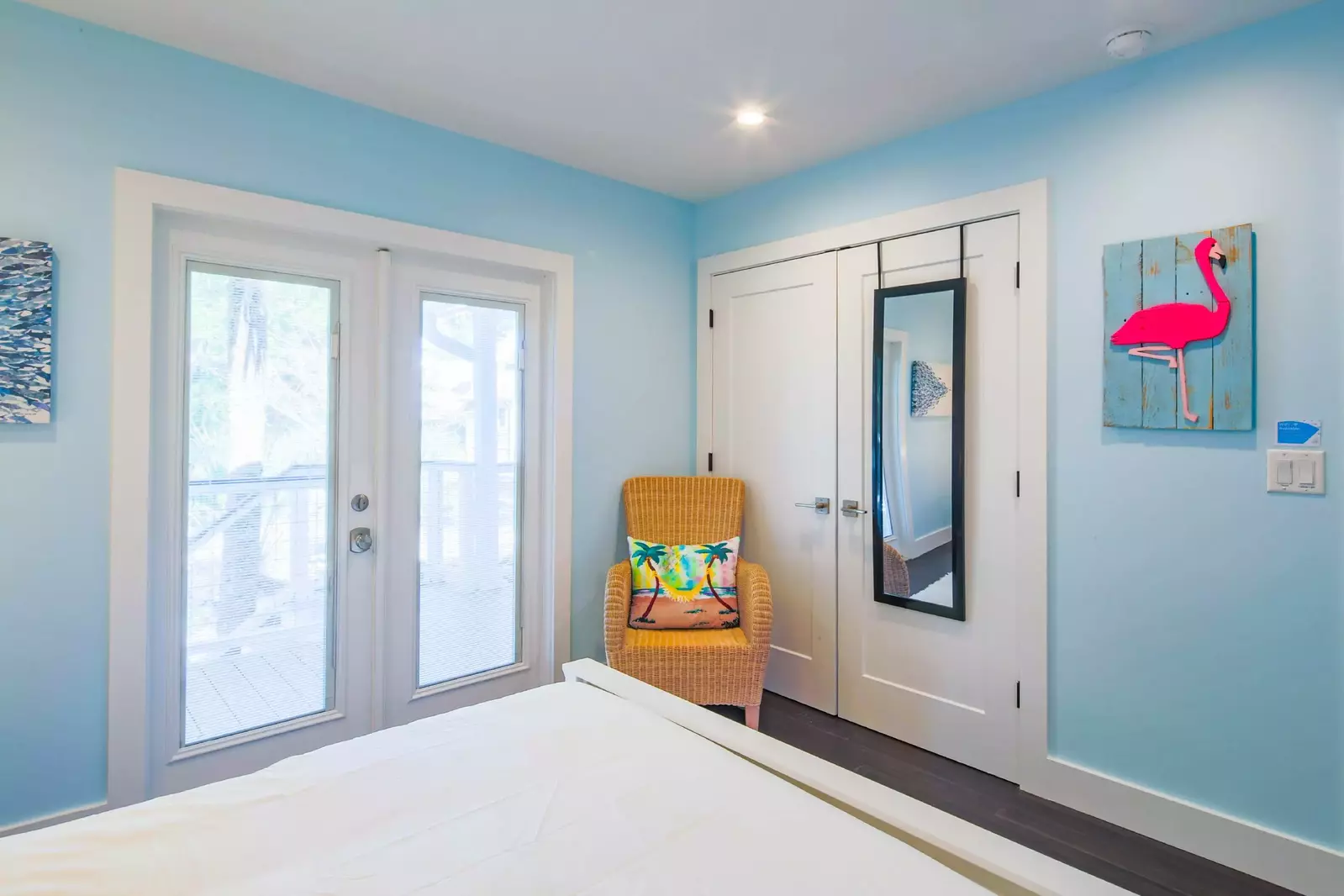 There is also an arm chair and closet within the queen bedroom.