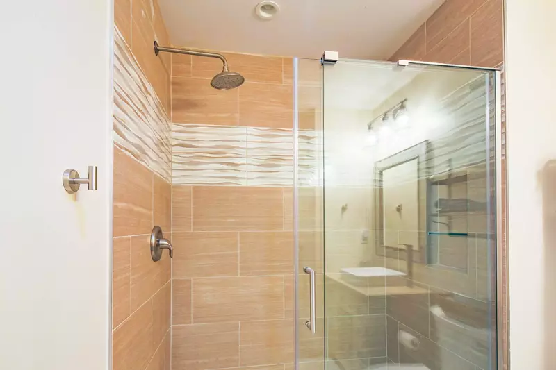 The hallway bathroom also has a beautifully-tiled, walk-in shower.