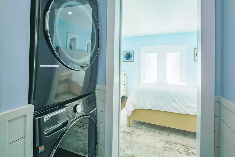 There is a stacked washing machine & dryer within the primary suite.
