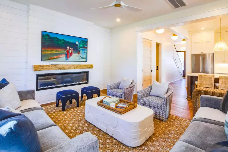 The home features high ceilings, beautiful light fixtures, shiplap walls and all new furniture.