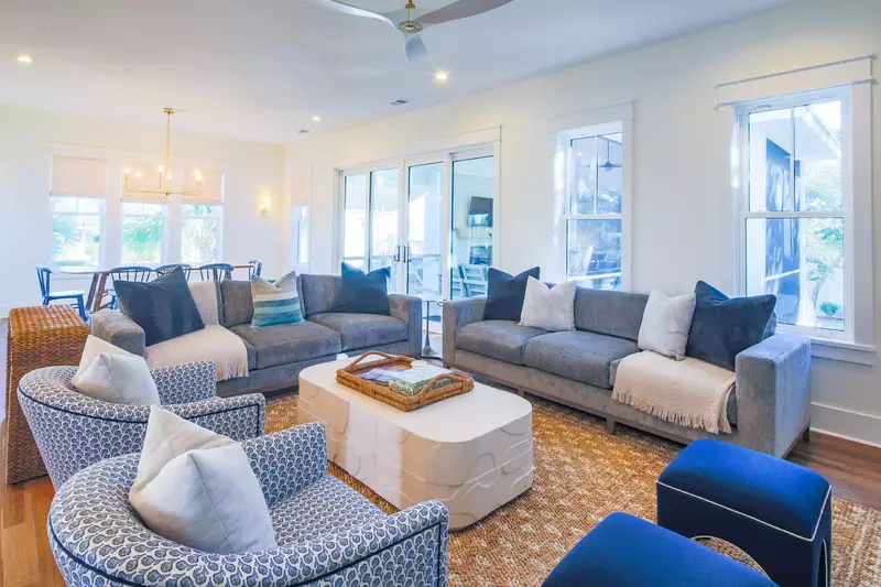 The sliding glass doors between the living room and dining area lead to the screened porch.
