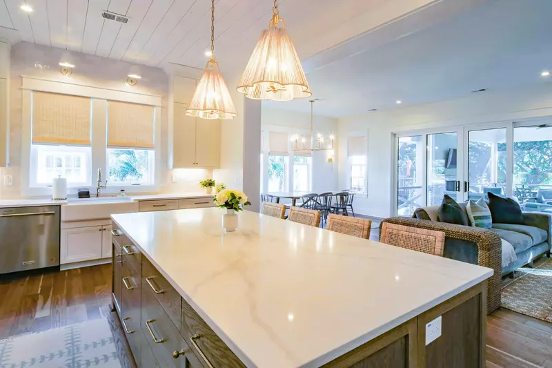 The open floor plan makes it easy to interact with guests in the kitchen, living room and dining area.