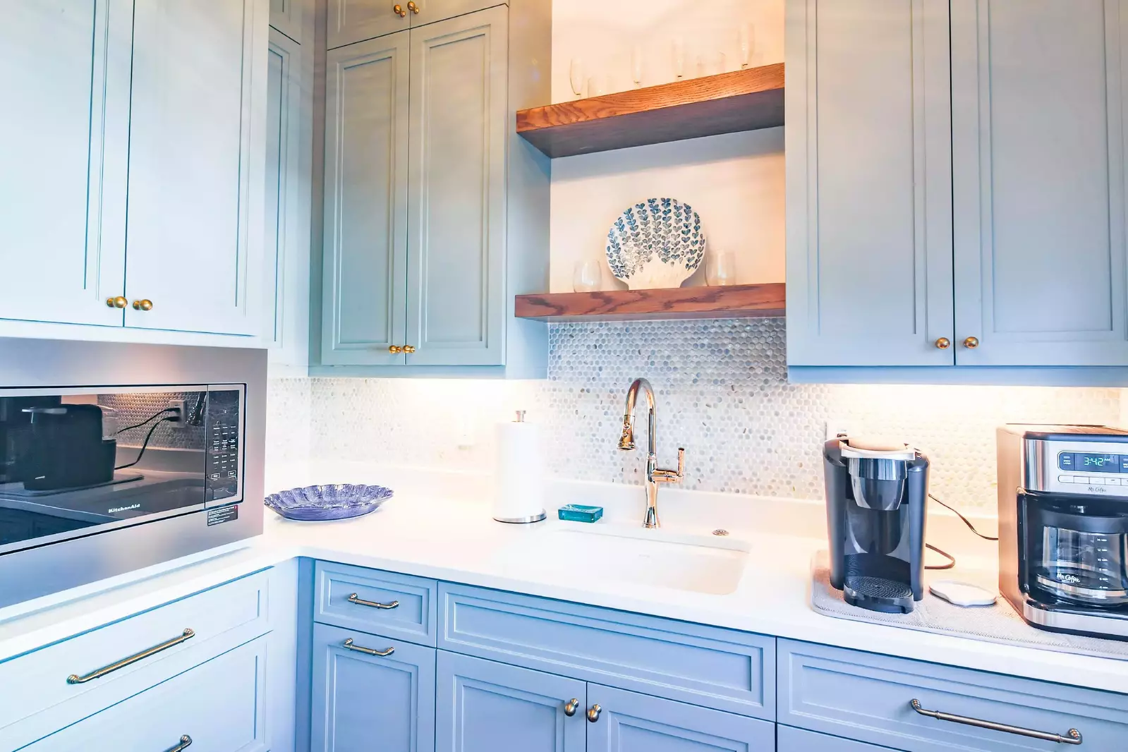 The pantry features a microwave, drip coffee maker and sink.