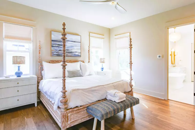 The sun-drenched primary suite also has an en suite bathroom.