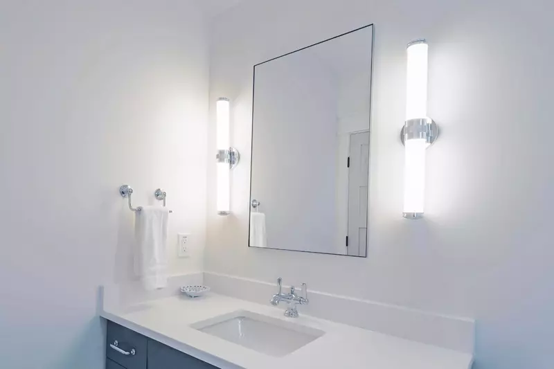 The en suite bathroom features a spacious vanity.