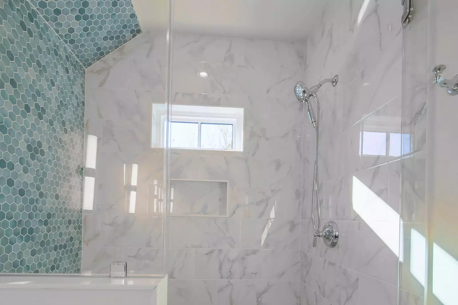 The en suite bathroom also has the gorgeously-tiled, walk-in shower.