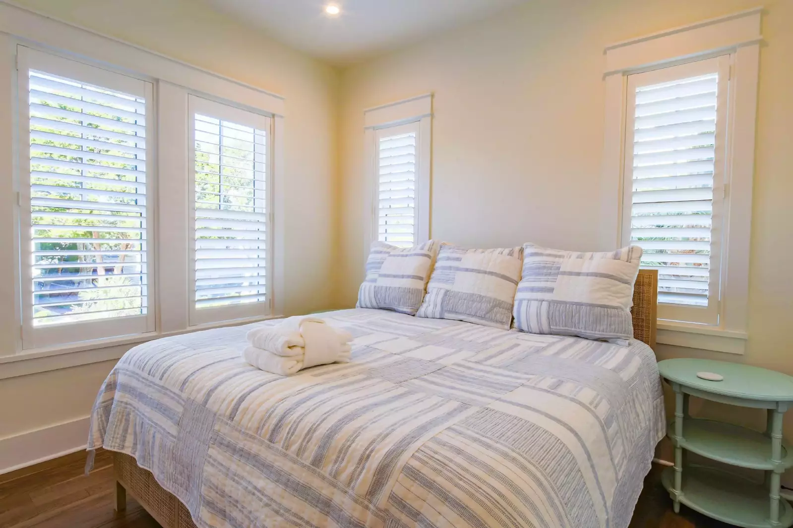 The downstairs guest bedroom features a king bed with night stands.