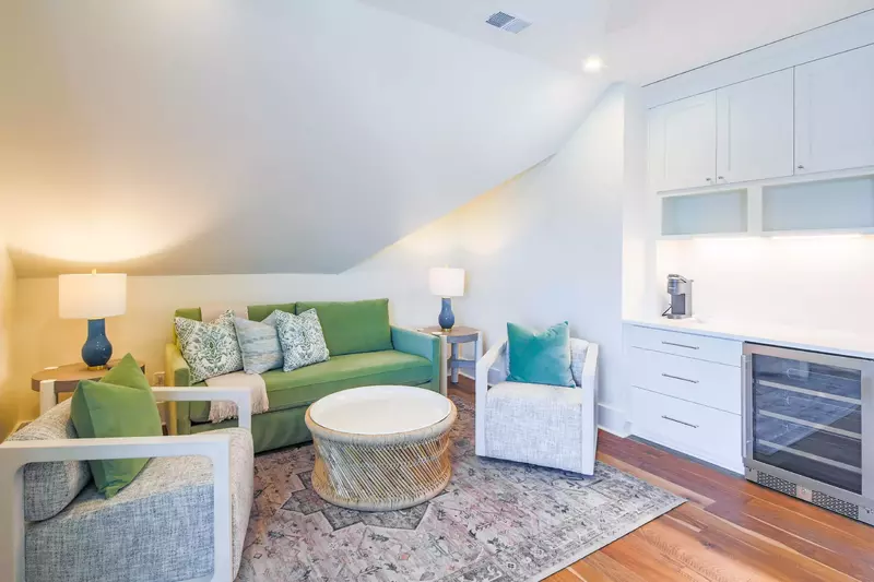 The family room features a comfortable seating area and drink refrigerator.