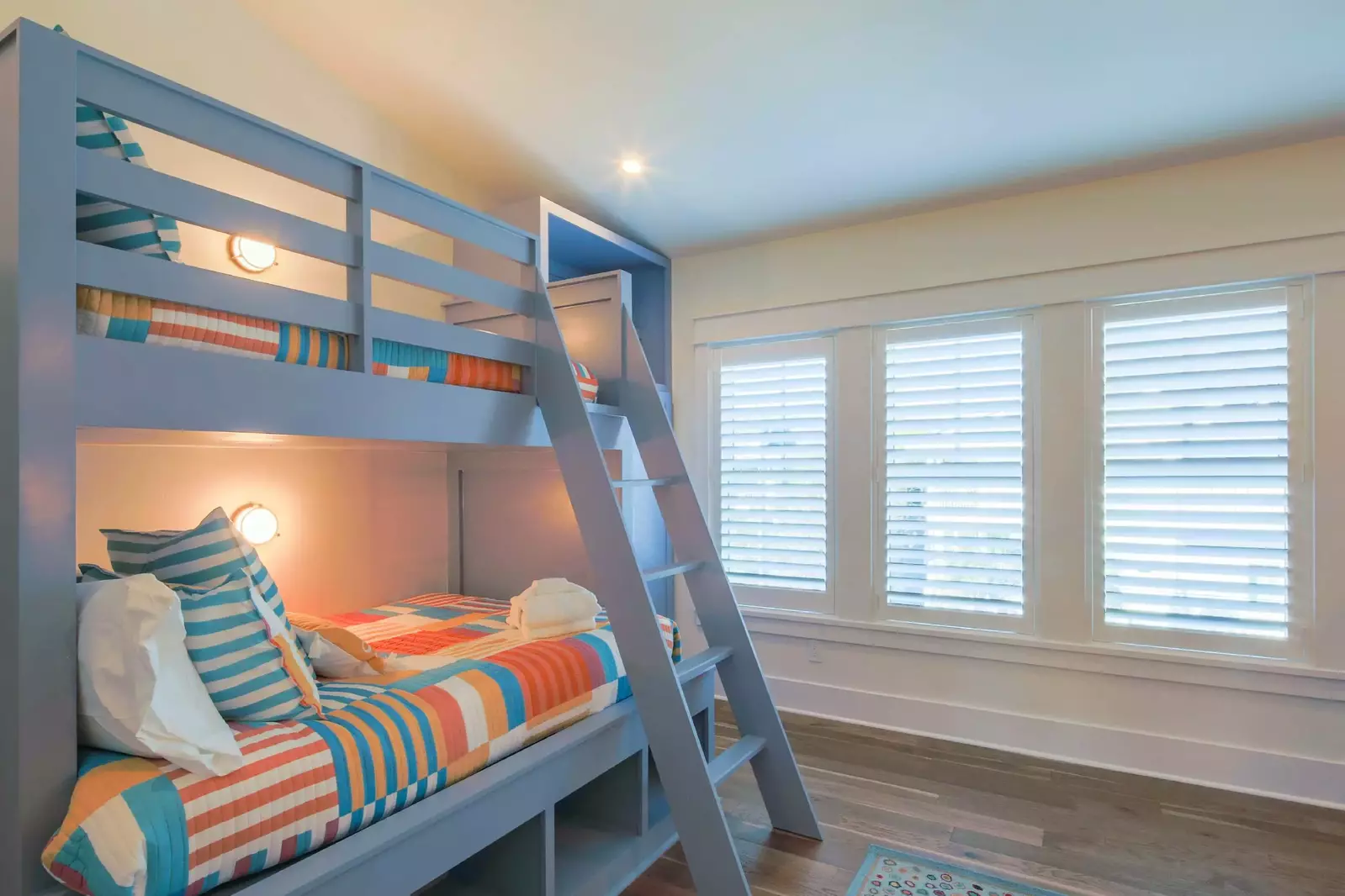 The bunk bedroom features two separate built-in bunk beds.
