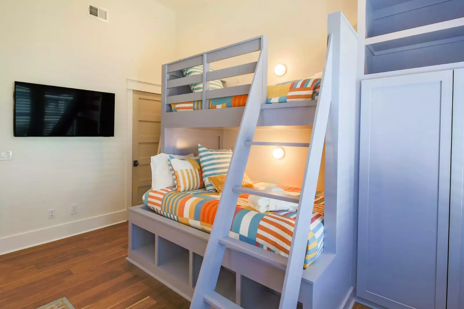 There is also a wall-mounted TV in the bunk bedroom.