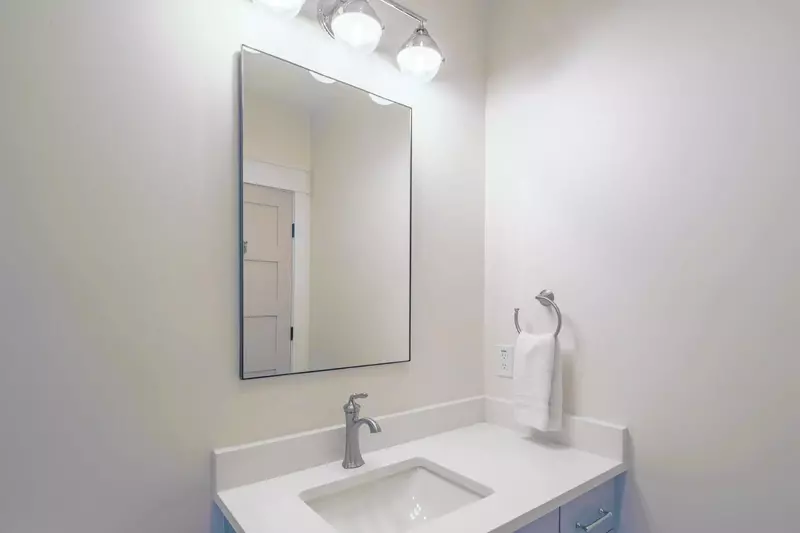 The en suite bathroom in the bunk bedroom features a vanity.