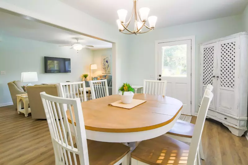 The dining table comfortably seats 6.