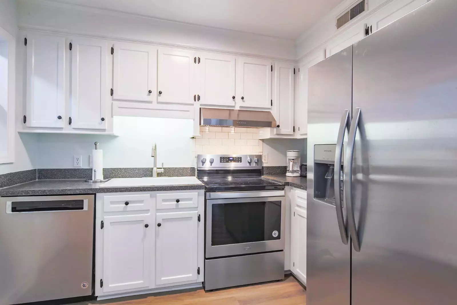 There is also a refrigerator, coffee maker and toaster.