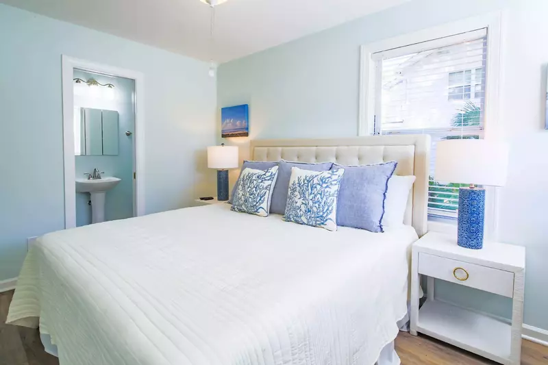 The door to the left of the bed leads to the en suite bathroom.